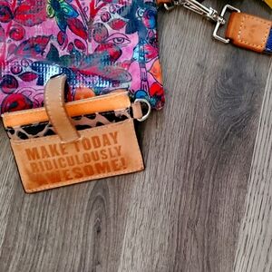 Conseula bag very colorful it's great also comes with card holder multi colored